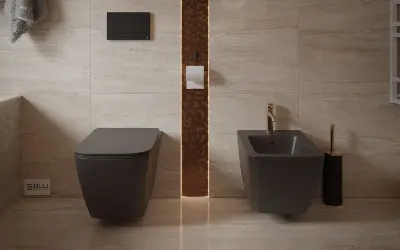 Nowoczesna łazienka z podwieszanym WC i bidetem. Złota armatura i dekoracyjna ściana dodają elegancji. Dowiedz się, jak korzystać z bidetu dla higieny.
