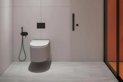 Nowoczesna łazienka z podwieszanym WC, bidetką i drzwiami z pionowymi żłobieniami. Odległość WC od ściany bocznej jest optymalna.
