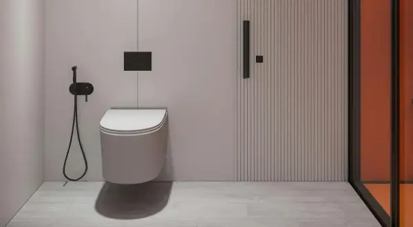 Nowoczesna łazienka z podwieszanym WC, bidetką i drzwiami z pionowymi żłobieniami. Odległość WC od ściany bocznej jest optymalna.